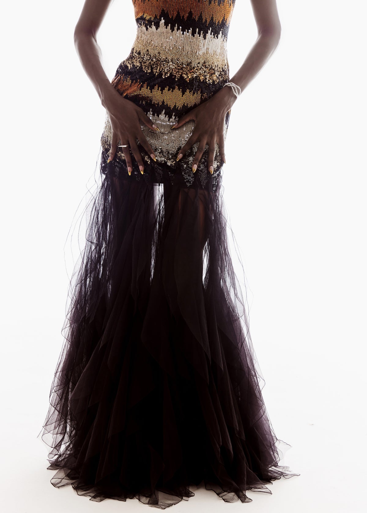 Long black dress with a patterned top on a white background