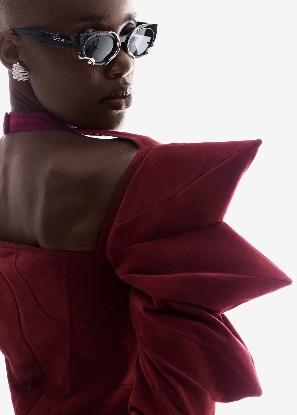 Person wearing a red dress on a white background