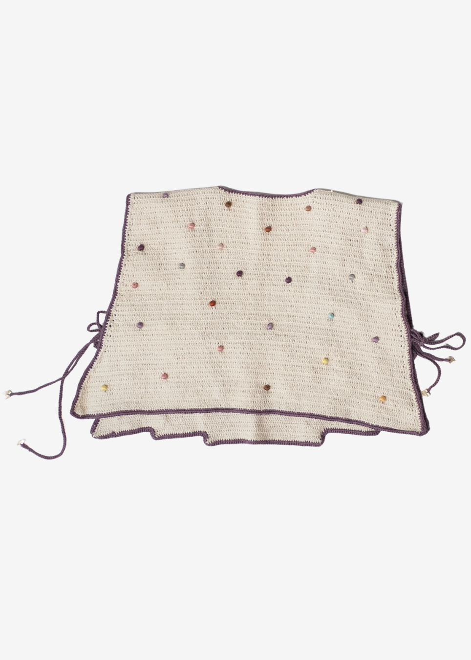 A cream-colored crocheted vest with dark purple trim and drawstrings, decorated with small multicolored beads, shown flat against a light gray background.