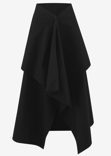 A black asymmetrical wrap skirt with a draped, layered design and a front tie detail, shown against a plain light gray background.