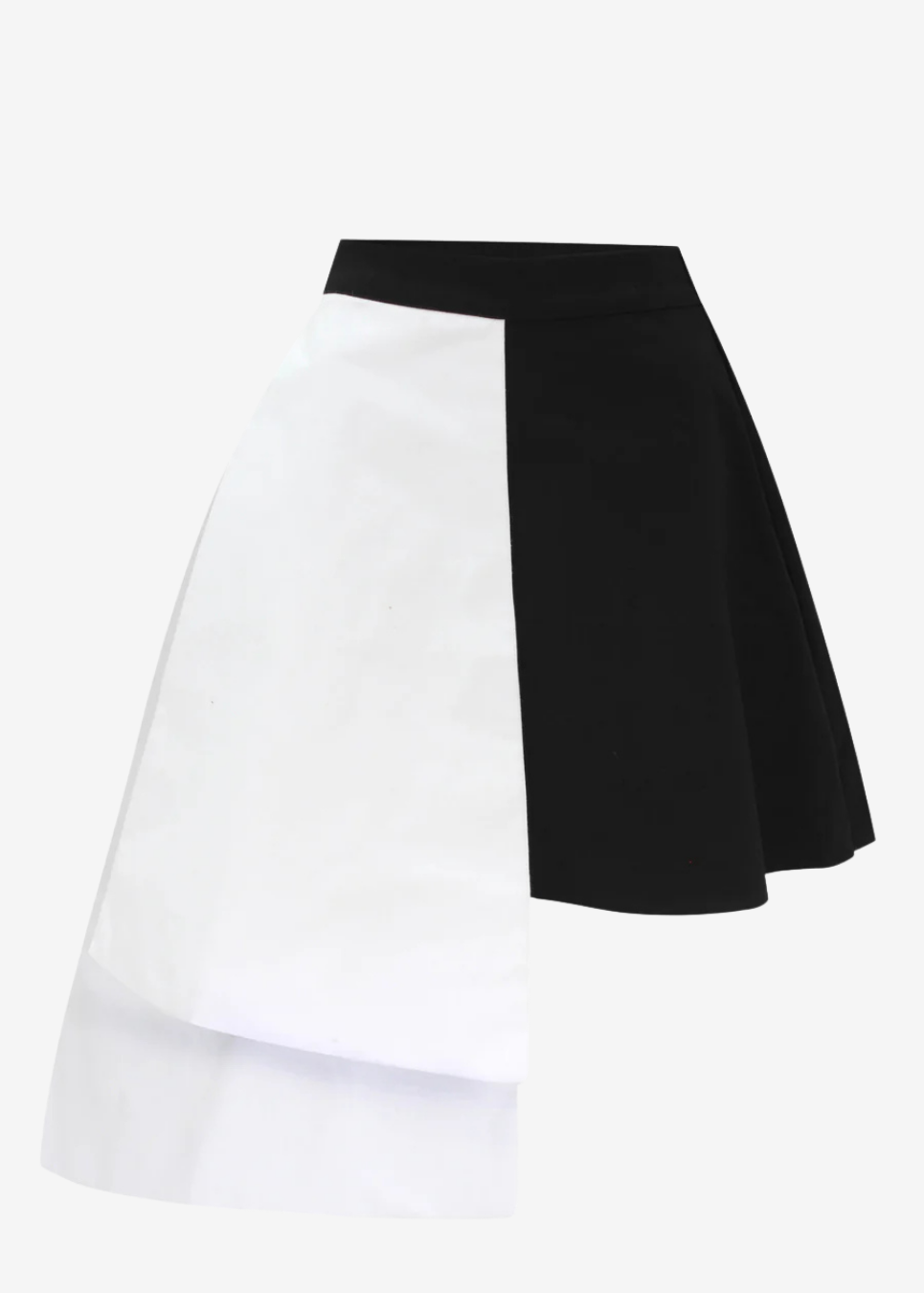 A color-blocked A-line mini skirt with a diagonal split design, featuring a solid white front panel and a solid black back panel, set against a plain light gray background.