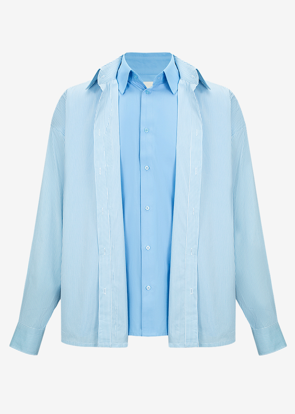 A light blue long-sleeve button-up shirt with a relaxed, oversized fit, shown against a plain white background.