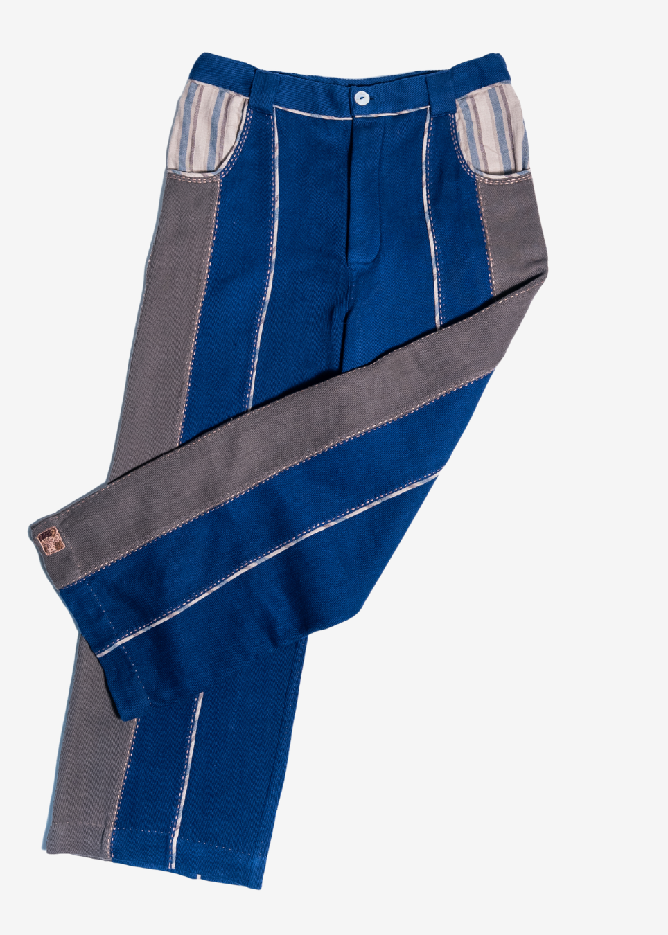 A pair of blue denim jeans with distinctive gray side panels and striped patch pockets, laid flat on a light gray background.