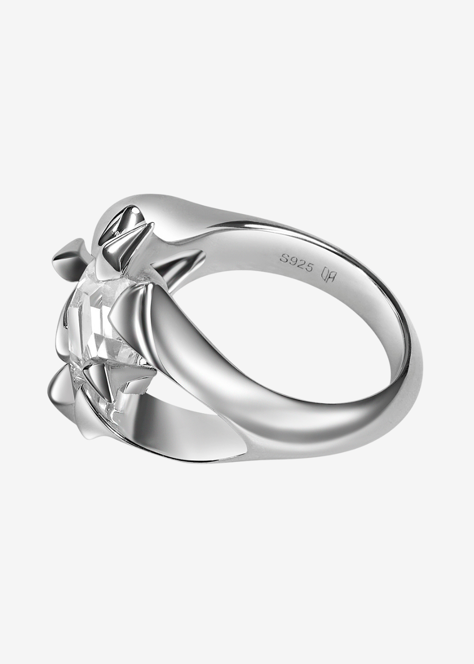 A silver ring featuring a sculptural design on the band, photographed on a clean light gray background. The inside of the band is stamped with 'S925 (N)', indicating sterling silver.