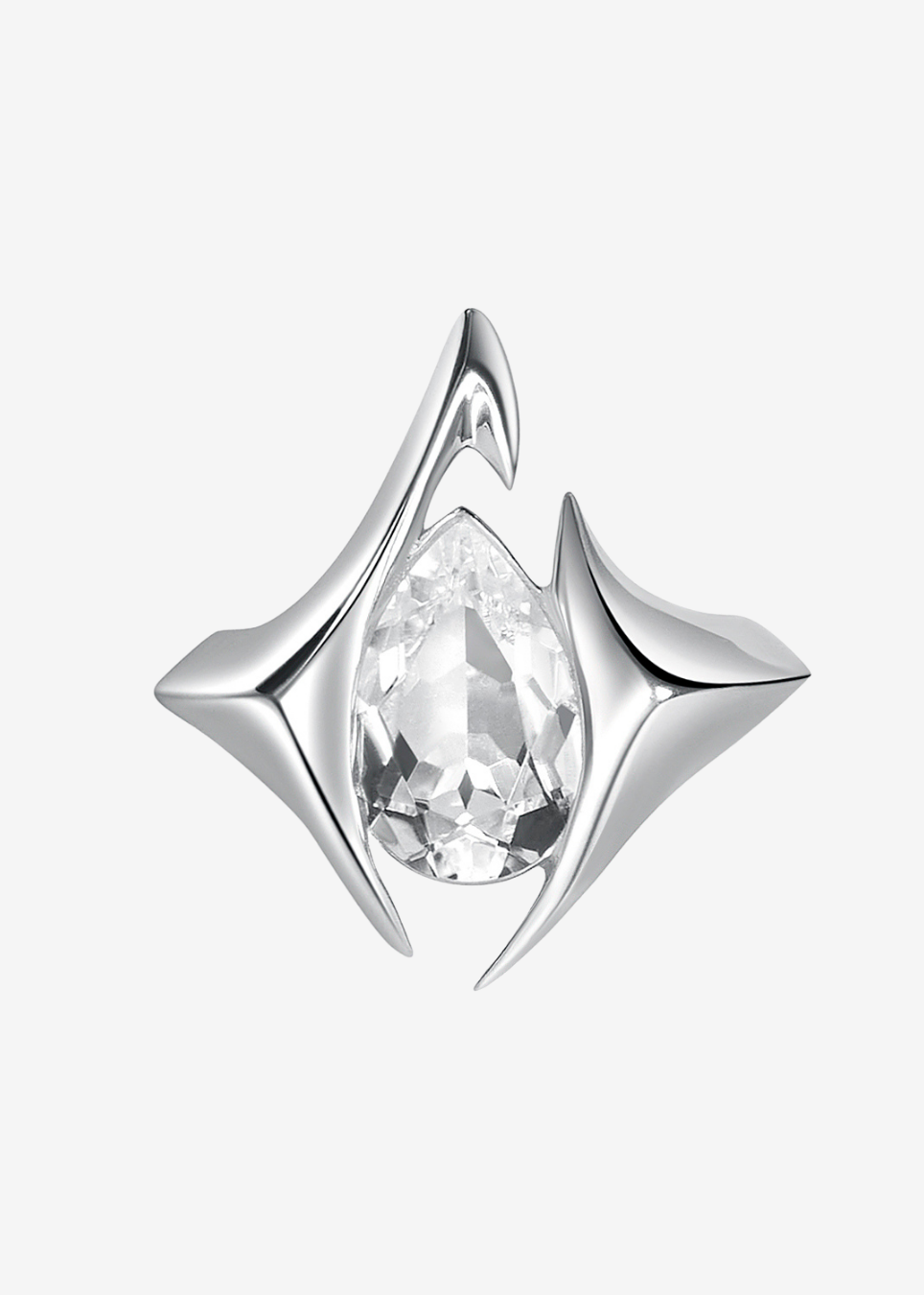 A silver-toned geometric ring featuring a central pear-cut clear gemstone, set against a plain light gray background.