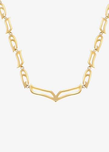 A gold link necklace featuring a central openwork V-shaped link connected to elongated oval links, displayed against a light gray background.