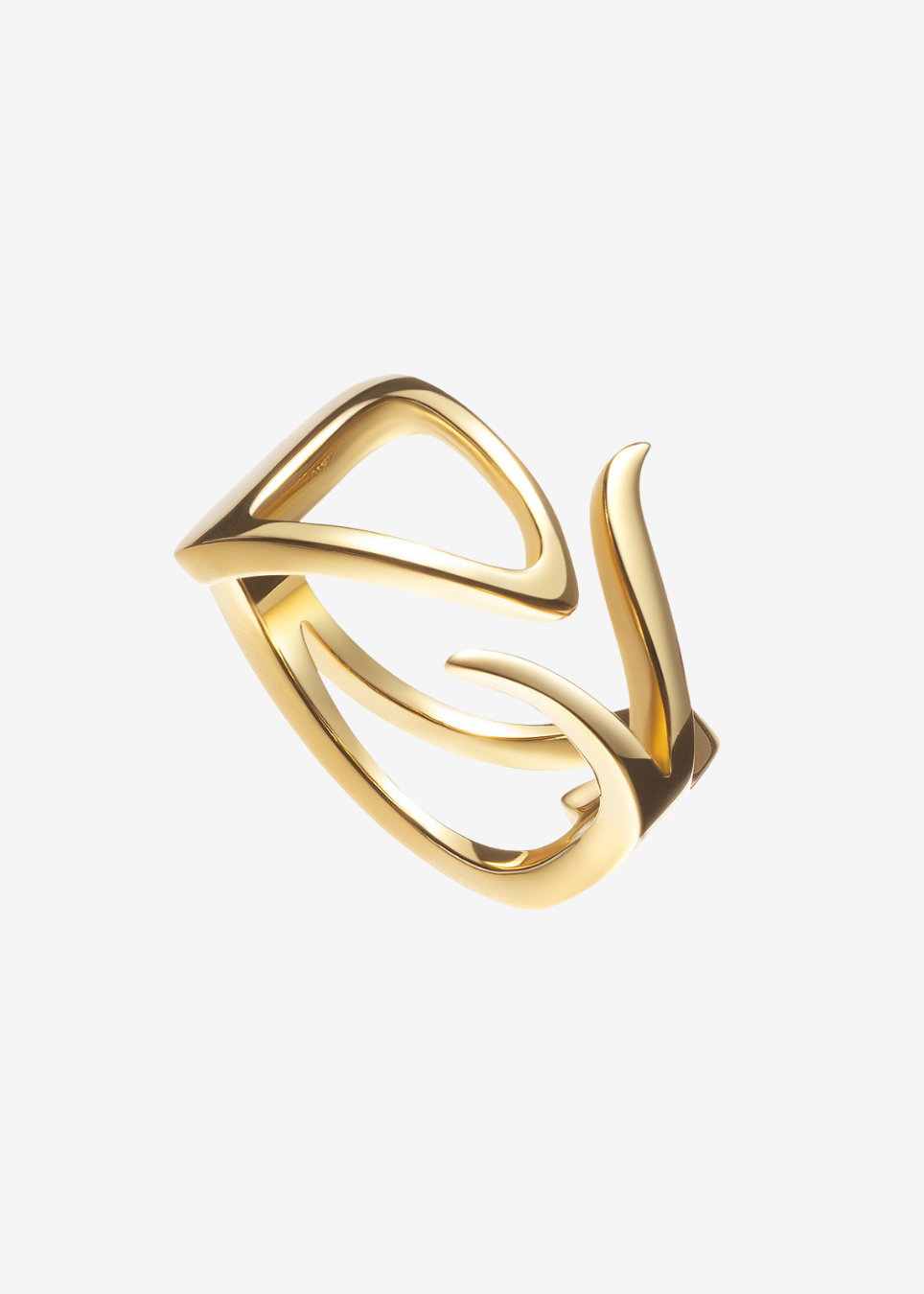 A gold-toned abstract open ring with a sculptural, flowing design, shown on a plain light gray background.