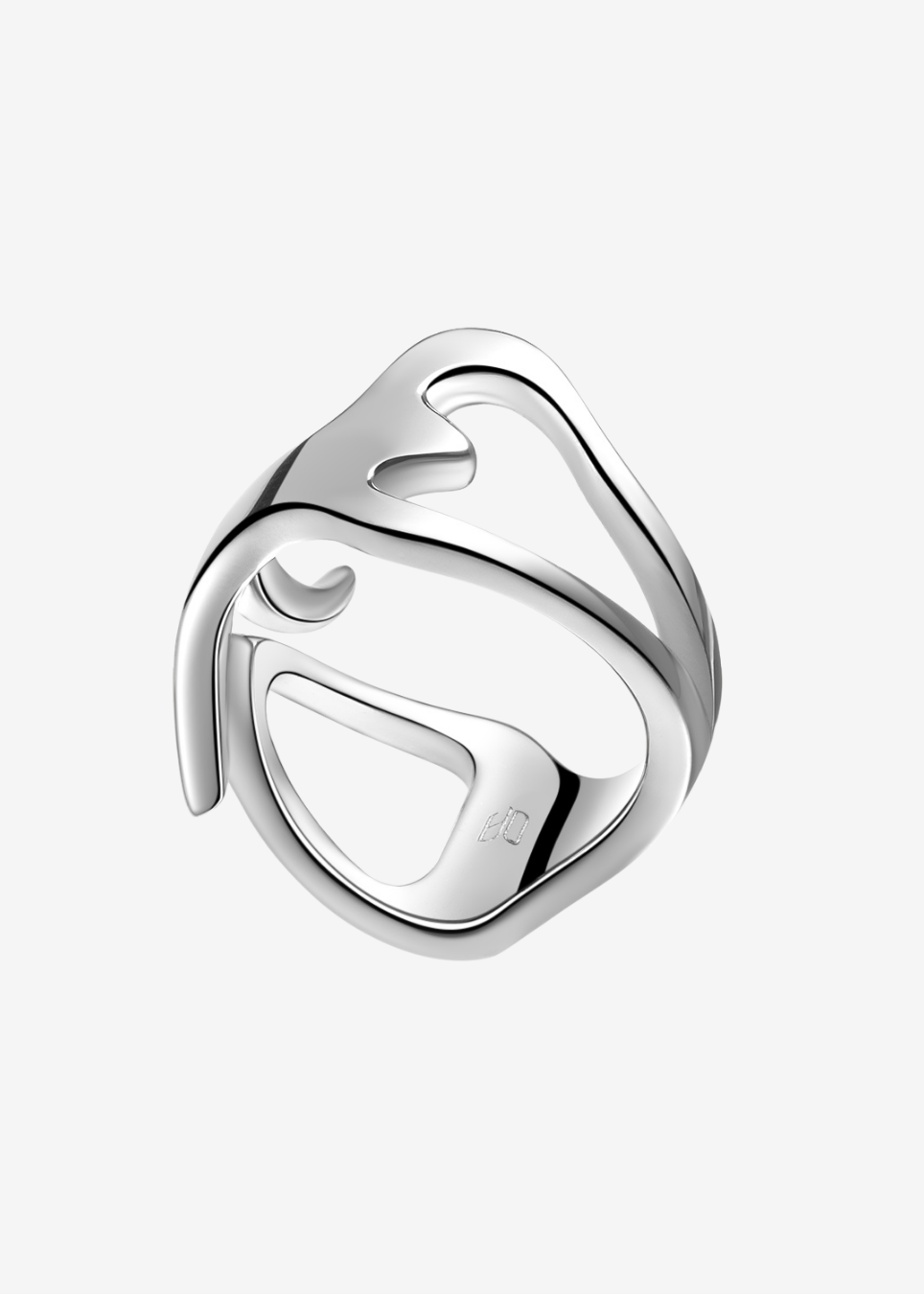 A polished silver-toned metal ring with an organic, flowing abstract shape and a small heart cutout, shown on a light gray background.