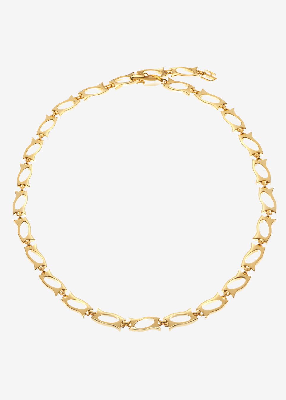 A gold-toned chain necklace with elongated oval links and small star-shaped accents, arranged in a circle on a light gray background.