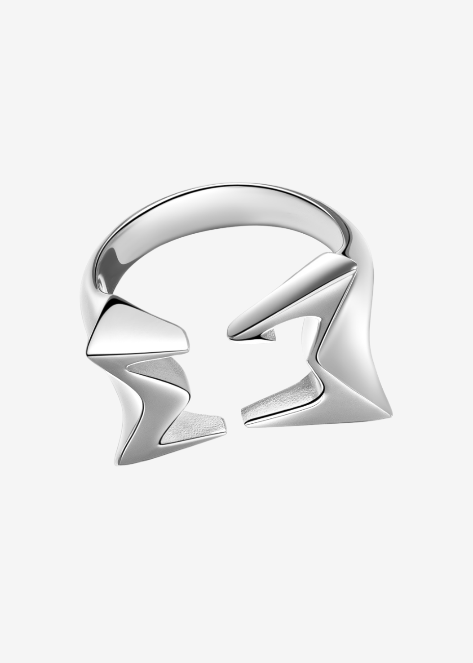 A silver-toned geometric open ring with sharp, angular, zigzag-like facets, shown on a plain light gray background.