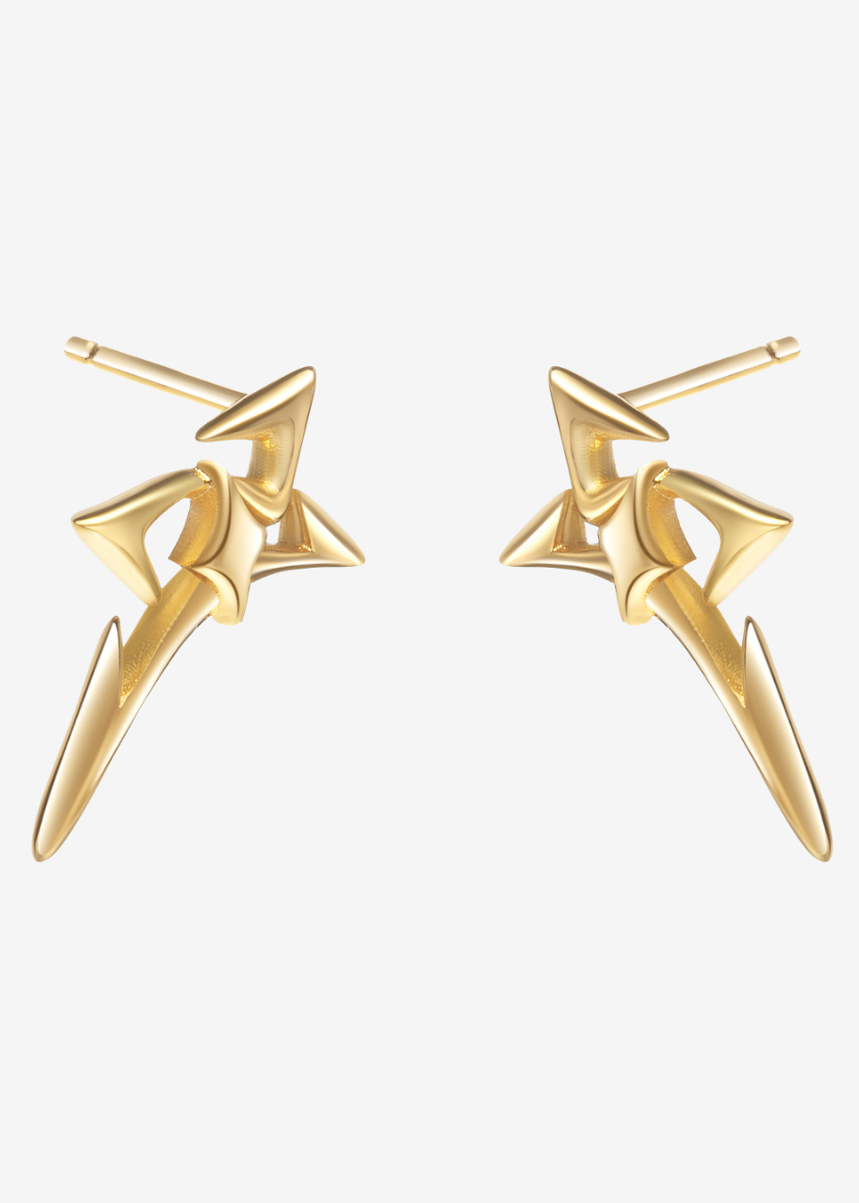 A pair of gold-toned geometric stud earrings with a star-like abstract design, shown on a plain light gray background.