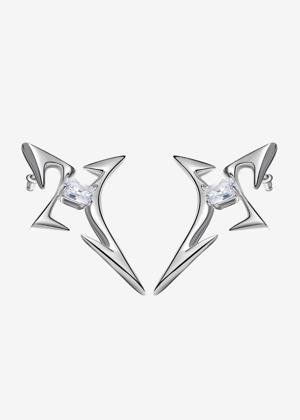 silver cross-shaped earrings featuring a quartz stone at center, on a white background