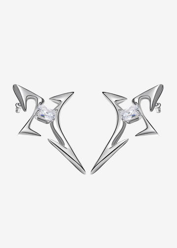 silver cross-shaped earrings featuring a quartz stone at center, on a white background